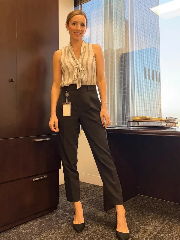 15 Business Casual Outfits for Women Over 40 7 6. Striped Tie Neck Top with Black Trousers