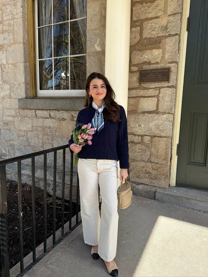 18 Preppy Outfits for Women Over 40 18 Navy Cable Sweater With a Silk Neckerchief and Ecru Jeans