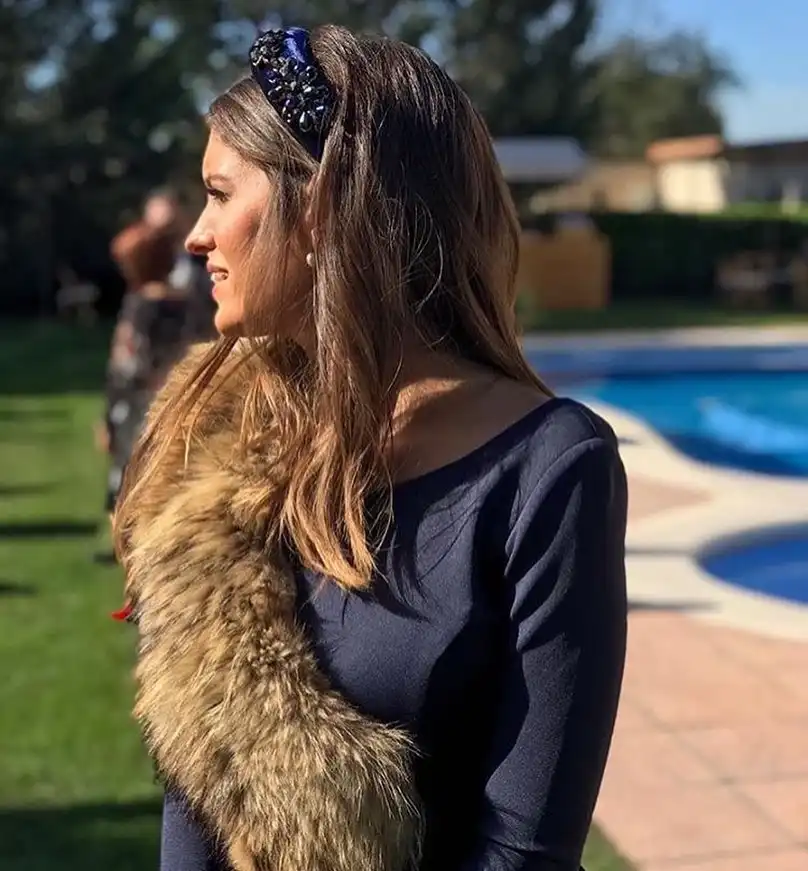 15 Winter Wedding Guest Outfits Over 40 That Handle the Cold 10 Navy Boat Neck Dress With a Jeweled Headband