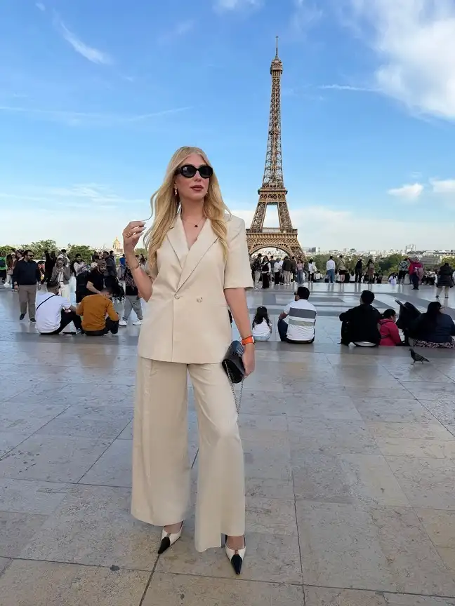 15 European Vacation Outfits for Women Over 40 10 Beige Linen Suit with Short Sleeves in Paris