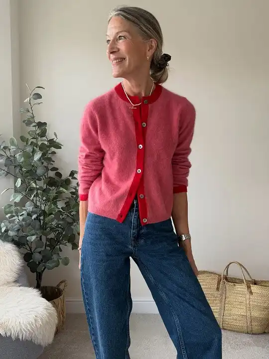 20 Classy Outfits for Women Over 40 7 Fuzzy Pink Cardigan with Dark Wide Leg Jeans