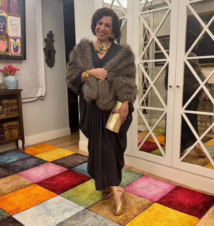 18 Retirement Party Outfits for Women Over 40 (Casual to Formal) 2 Black Draped Maxi Dress With a Fur Stole