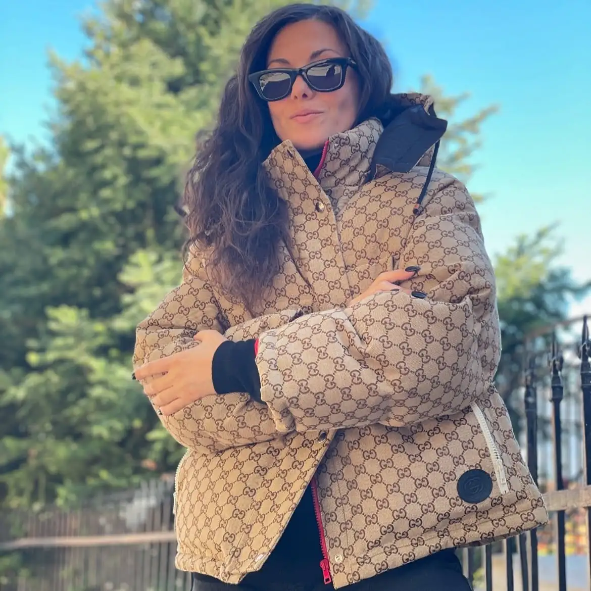 15 Puffer Jacket Outfits for Women Over 40 That Actually Look Chic 15 14. Try a Monogram Print Puffer for a Bit of Logomania