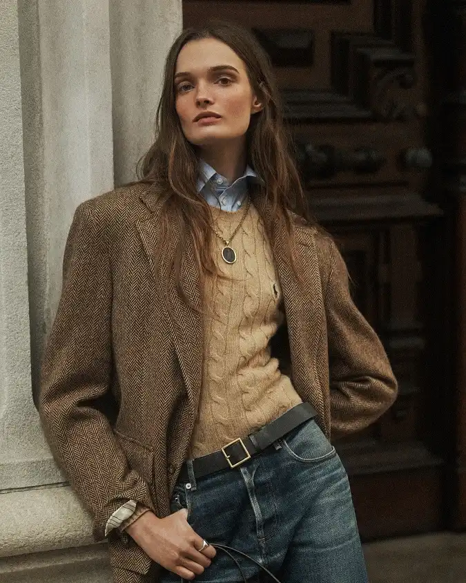 18 Preppy Outfits for Women Over 40 19 Herringbone Blazer Over a Camel Cable Knit and Blue Jeans