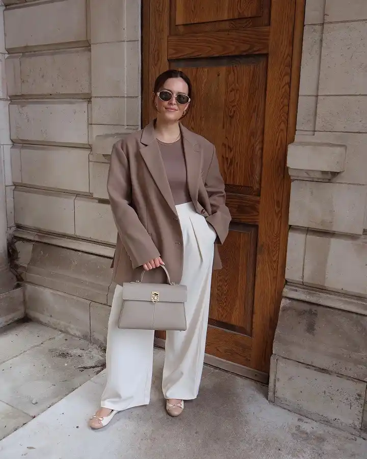 16 Spring Transitional Outfits Over 40 (Winter-to-Spring) 8 A Taupe Blazer With Cream Wide Trousers