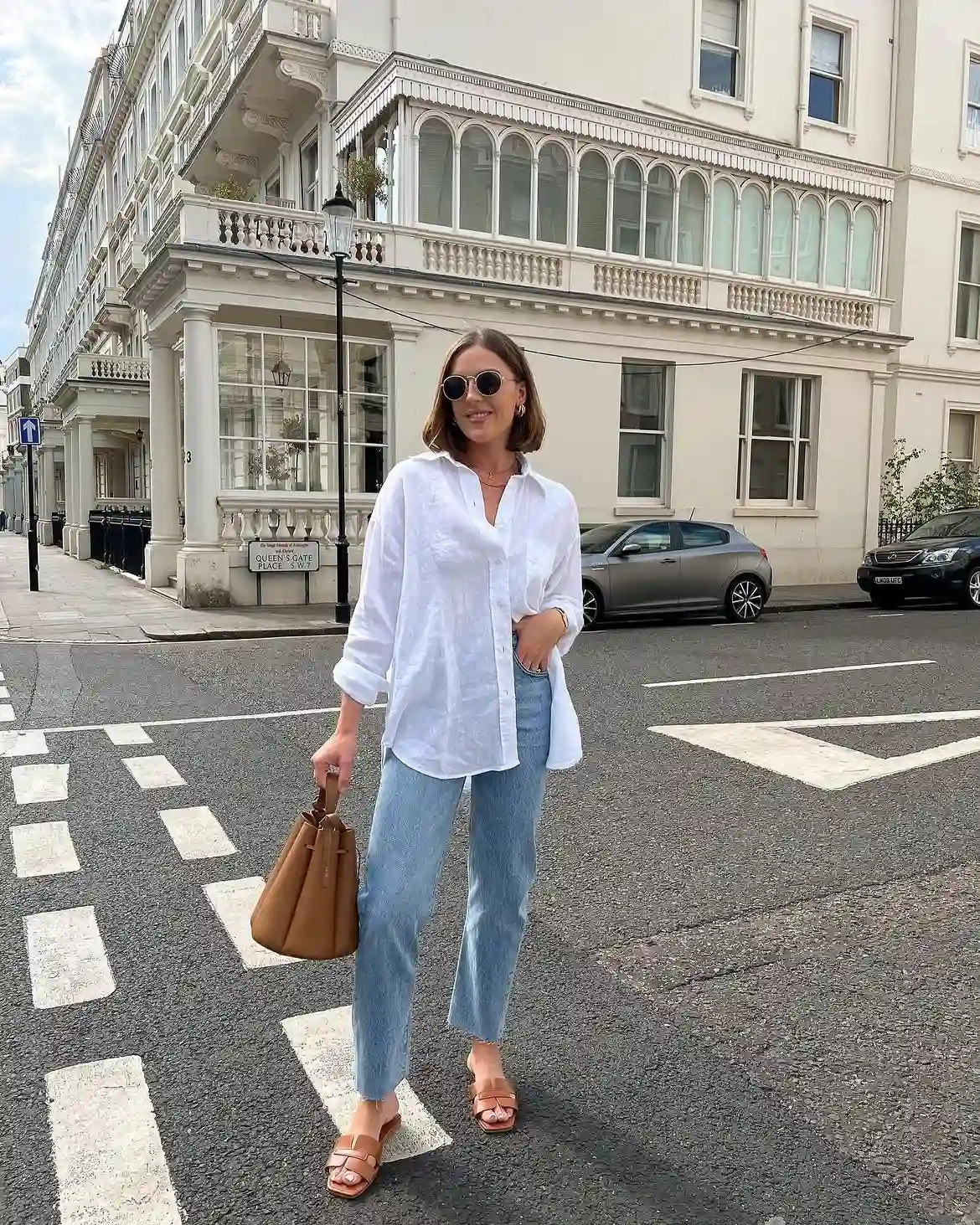 15 Linen Outfits for Women Over 40 That Feel Easy and Look Polished 3 2. Oversized White Linen Shirt With Light Wash Jeans