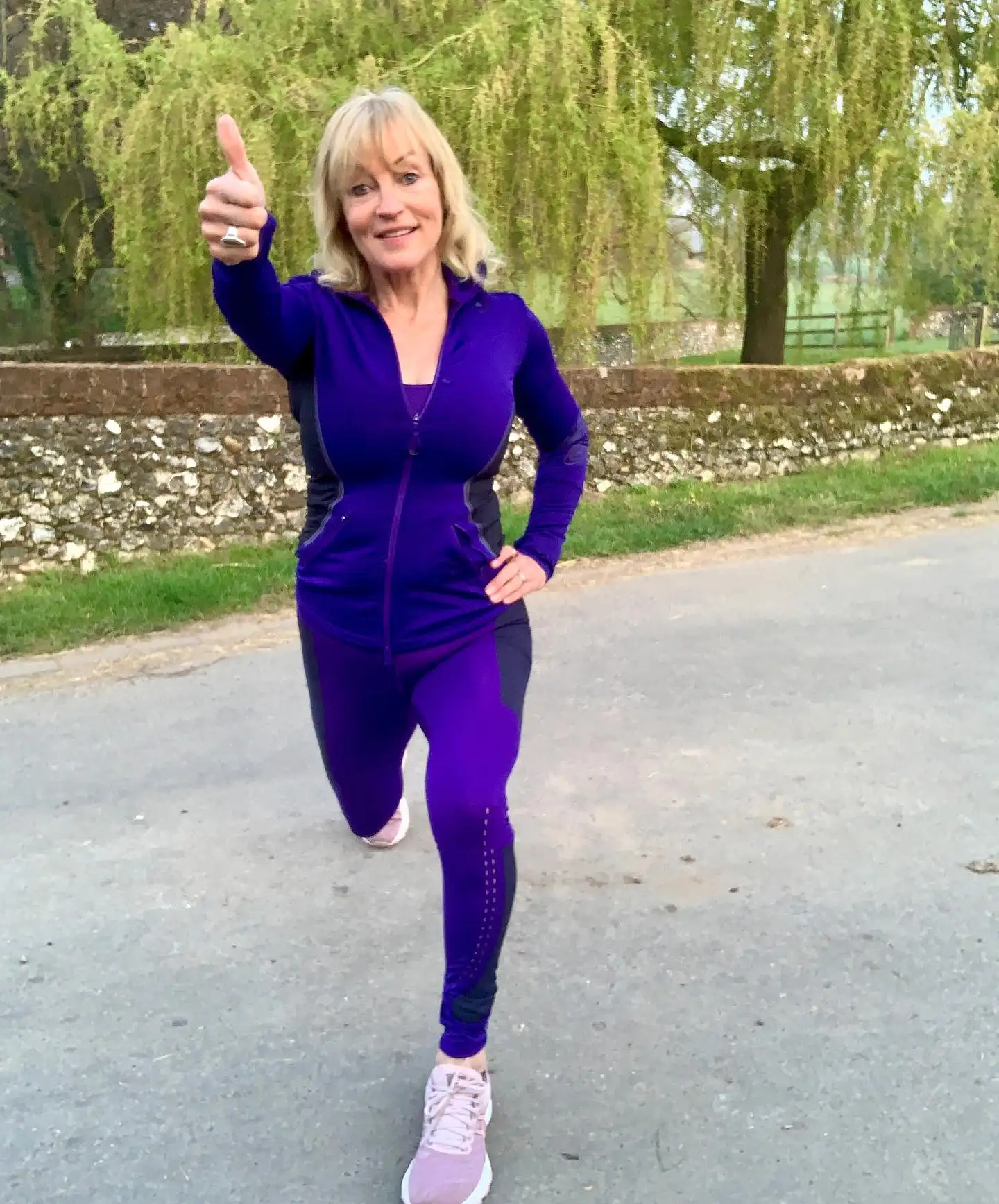 15 Athleisure Outfits for Women Over 40 4 3. Purple Zip Jacket and Matching Leggings