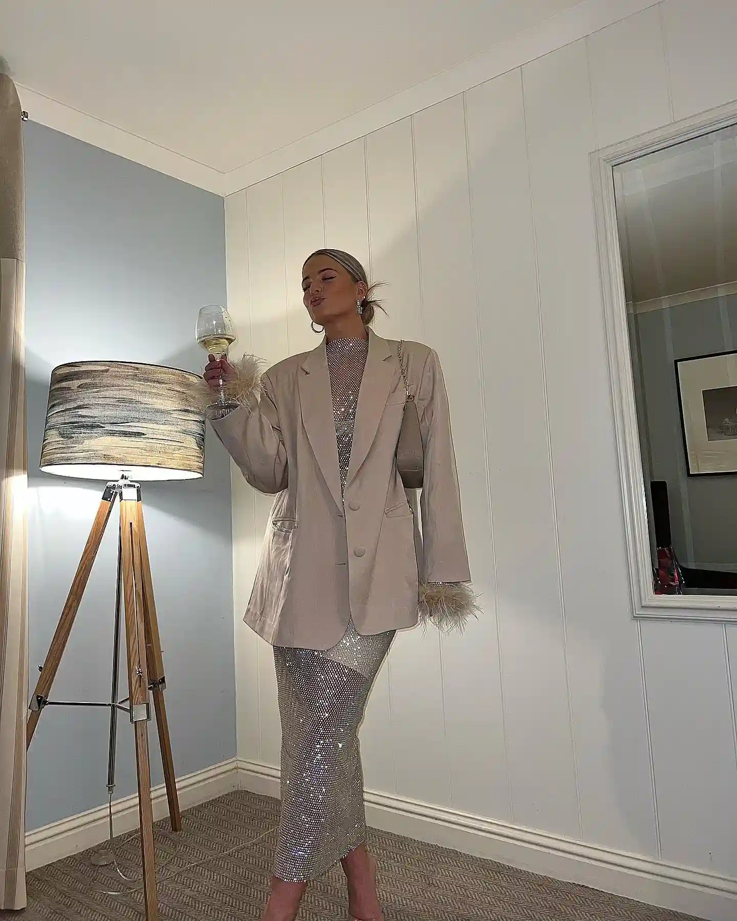 7. Feather Cuff Blazer over a Crystal Mesh Dress