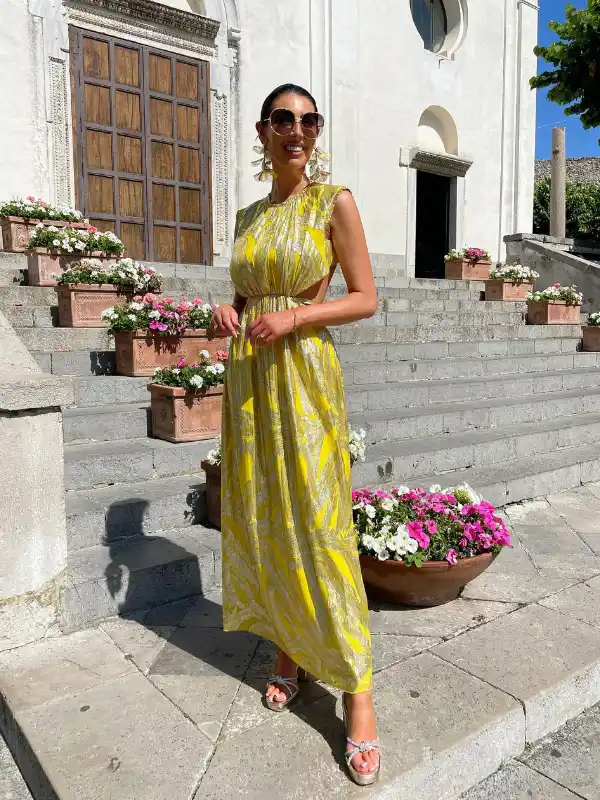 17 Fall Wedding Guest Dresses Over 40 That Look Expensive 8 7. Yellow Metallic Maxi With a Side Cutout