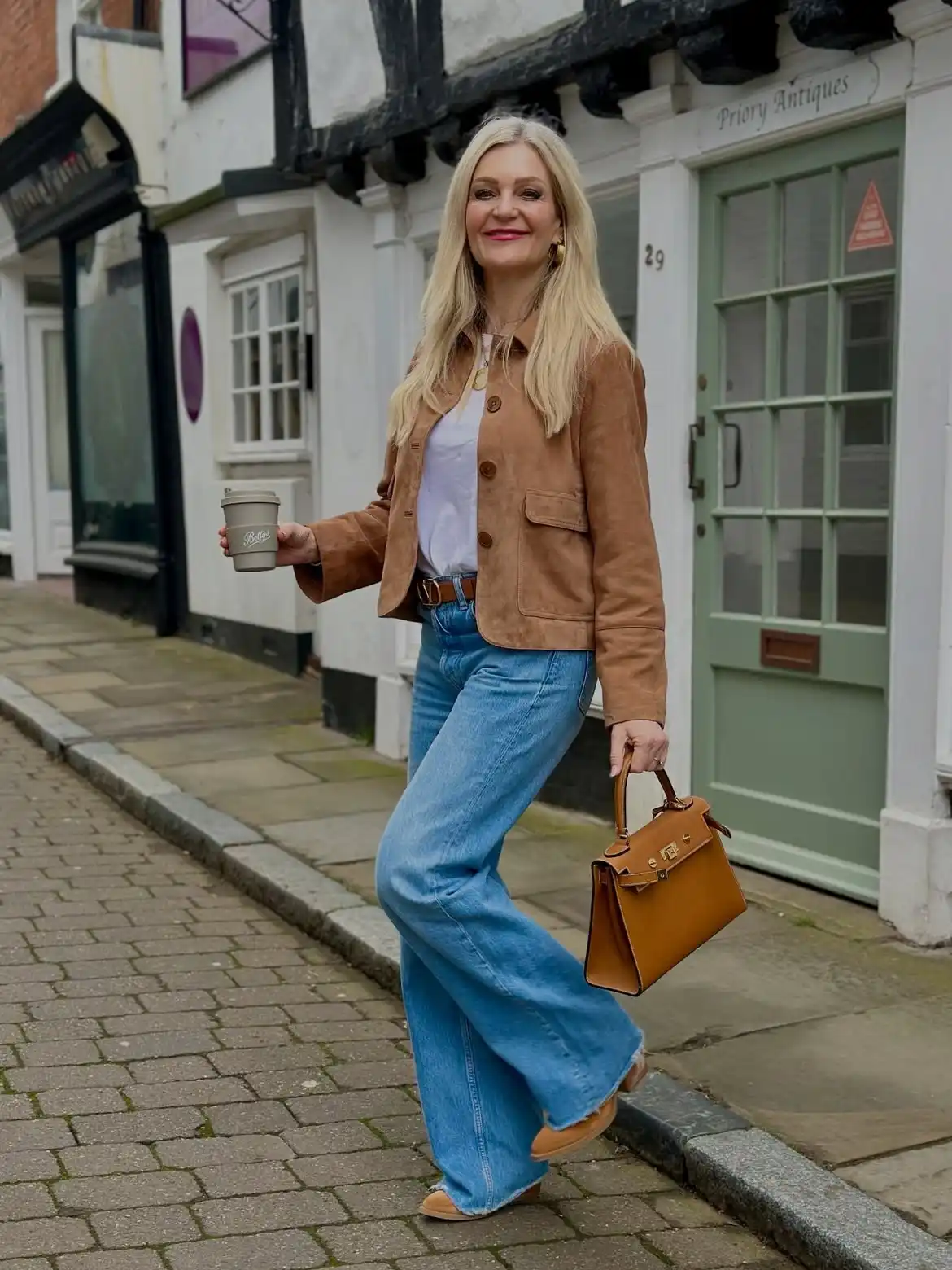 15 Leather Jacket Outfits for Women Over 40 That Actually Work 5 4. Suede Blazer Jacket with Flared Jeans
