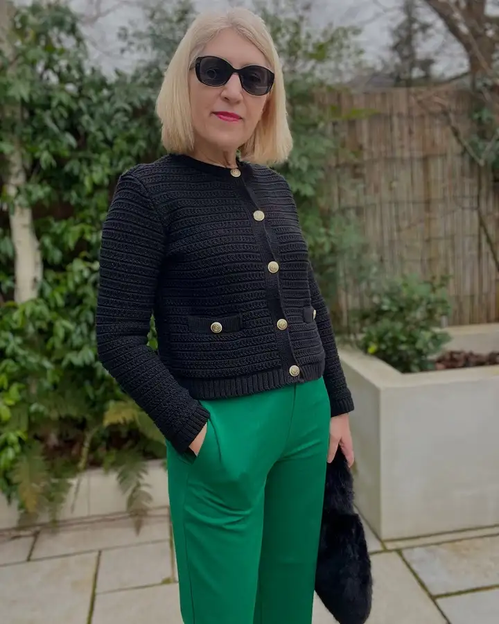 18 Spring Work Outfits for Women Over 40 That Feel Fresh, Not Fussy 10 Gold Button Knit Jacket With Emerald Trousers