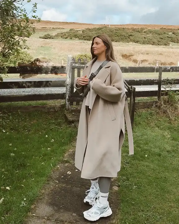 Long Oatmeal Wrap Coat Over Gray Leggings and Running Shoes