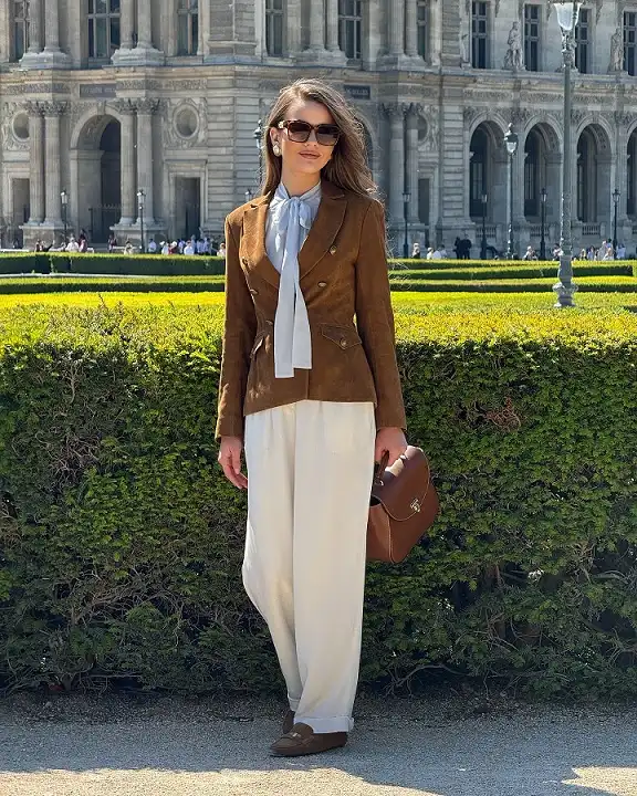 17 Old Money Outfits for Women Over 40 That Look Rich Without Trying 3 A Suede Jacket With a Bow Blouse and Wide Cream Trousers