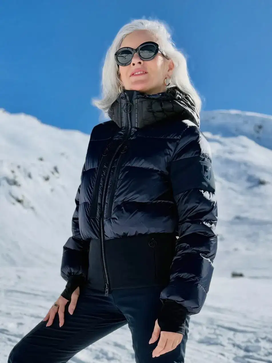 13. Black Puffer With Slim Black Pants and Round Sunglasses