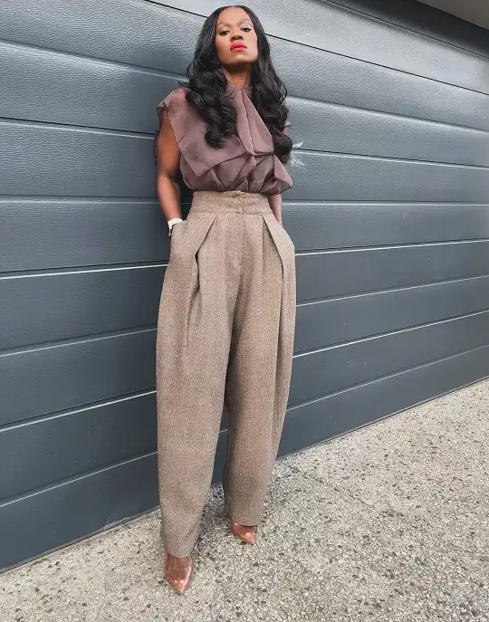 20 Quiet Luxury Outfits for Women Over 40 (Old Money Style, Real-Life Ready) 16 Pleated Wool Trousers With a Sheer Brown Blouse