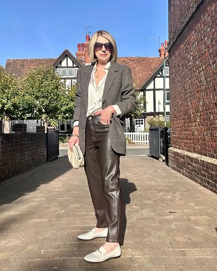 20 Work Outfits for Women Over 40 That Look Effortlessly Polished 5 Check Blazer, Satin Shirt and Brown Faux Leather Trousers