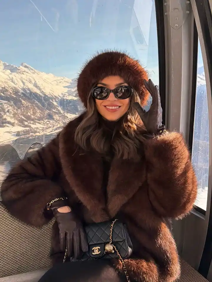 18 Winter 2026 Outfits for Women Over 40 6 A Chocolate Fur Coat and Matching Hat for Holiday Trips and Mountain Days