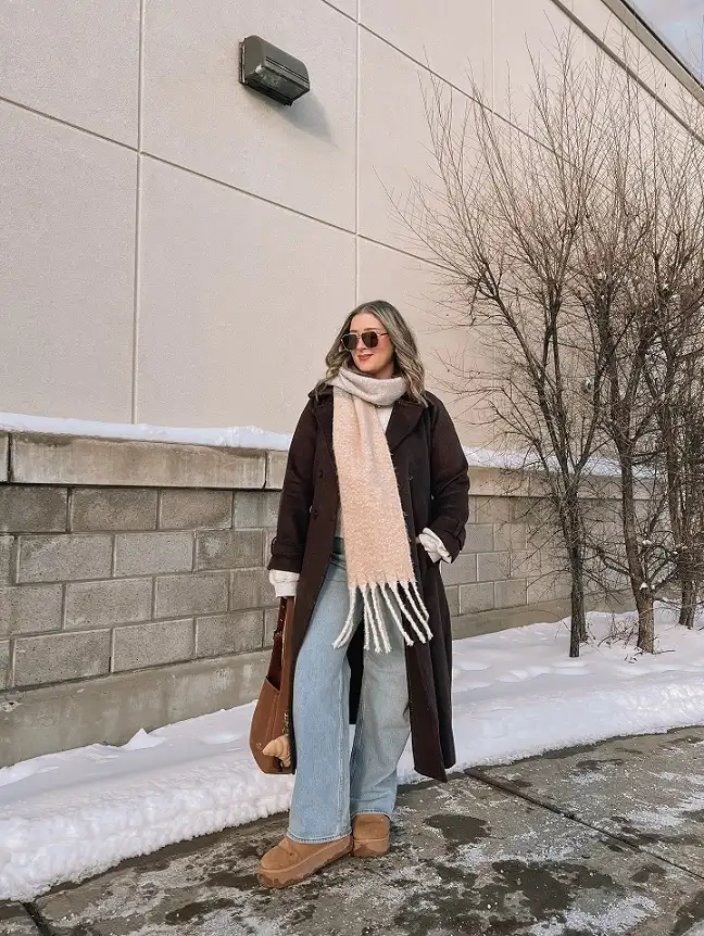 20 Chic Winter Outfits for Women Over 40 That Aren't Frumpy 3 Chocolate Brown Coat With a Fringed Scarf