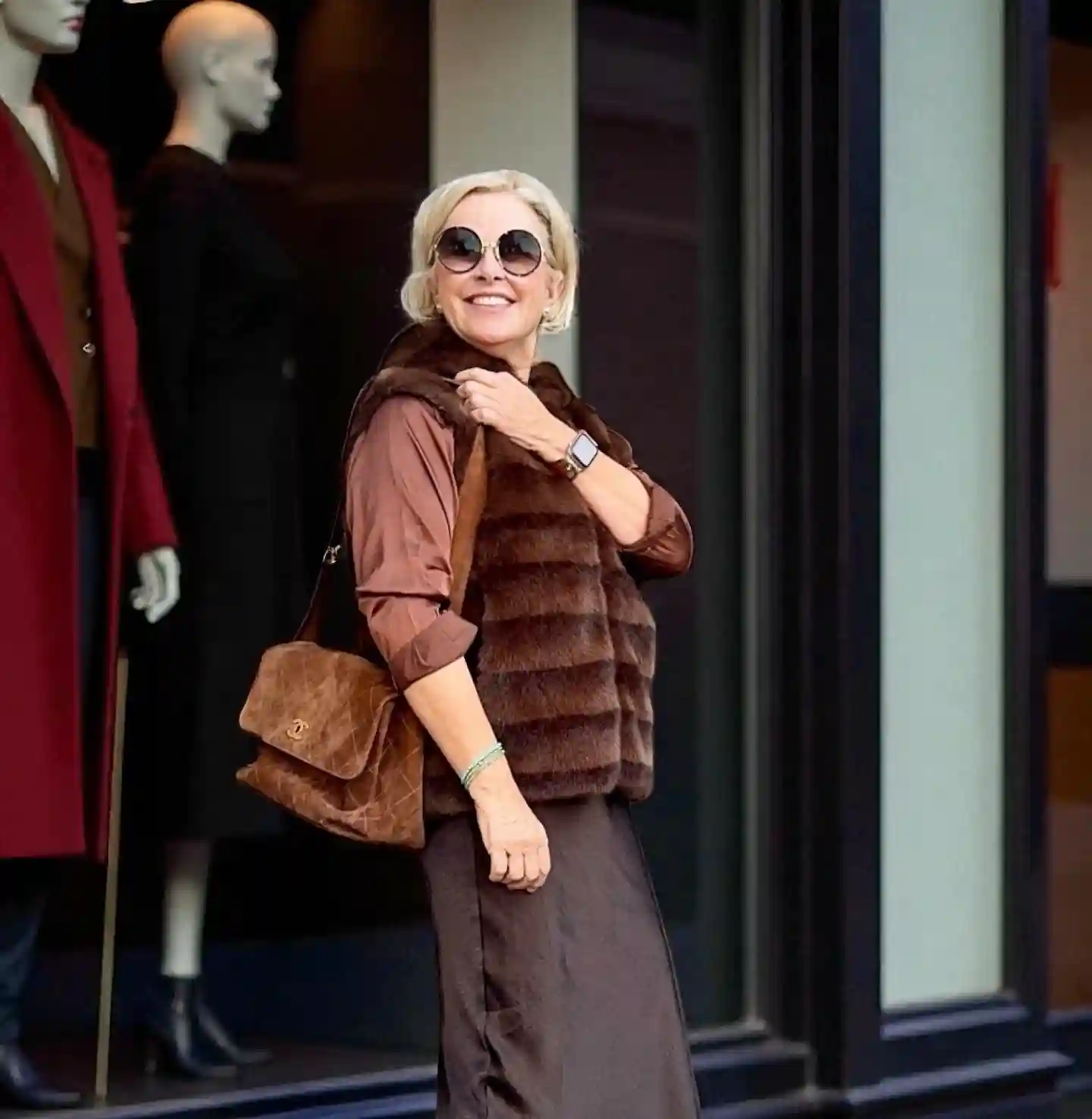 10. Brown Fur Vest with a Rust Shirt and Satin Skirt