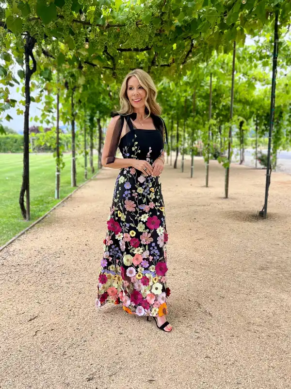 17 Fall Wedding Guest Dresses Over 40 That Look Expensive 12 11. Black Embroidered Floral Gown With Tie Straps