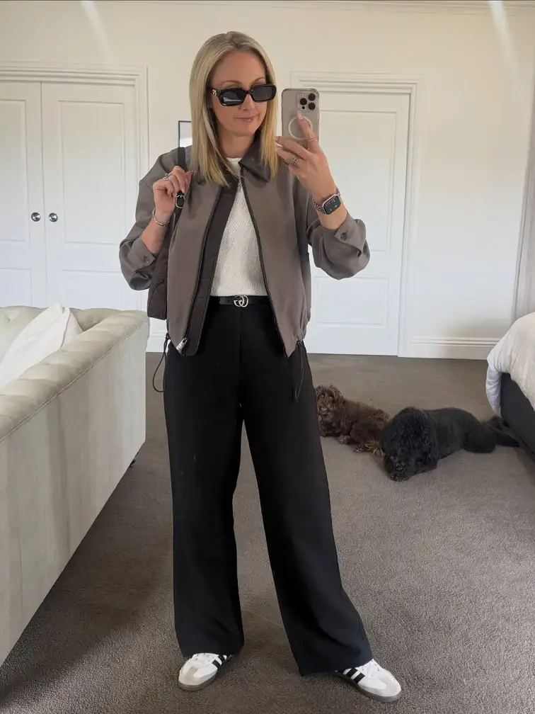 20 Work Outfits for Women Over 40 That Look Effortlessly Polished 11 Taupe Zip Jacket with Black Wide Leg Trousers
