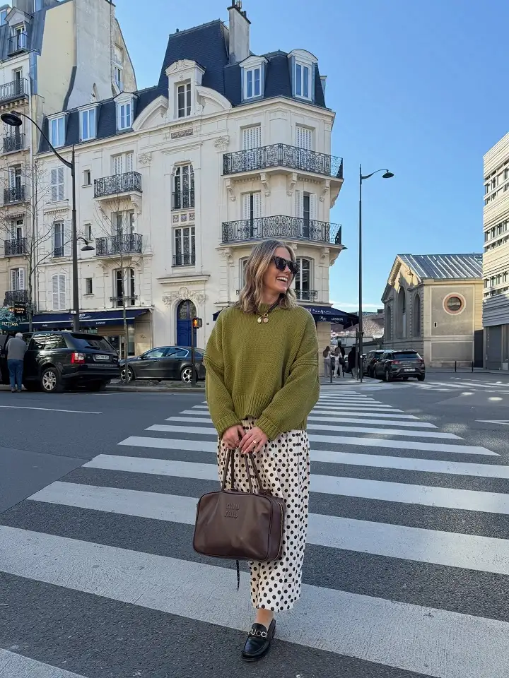 20 Work Outfits for Women Over 40 That Look Effortlessly Polished 2 Olive Knit Sweater with a Polka Dot Midi Skirt