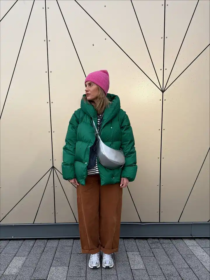 18 Winter Work Outfits for Women Over 40 2 A Bright Puffer Coat For Cold Commute Mornings