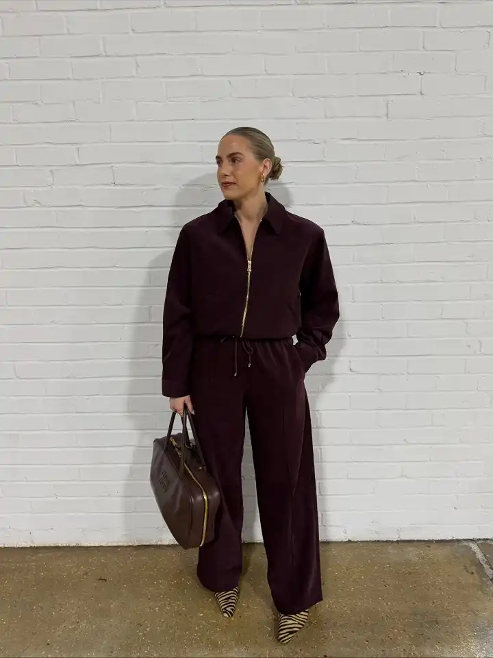 16 Spring Transitional Outfits Over 40 (Winter-to-Spring) 9 A Rich Plum Matching Set With Wide Trousers
