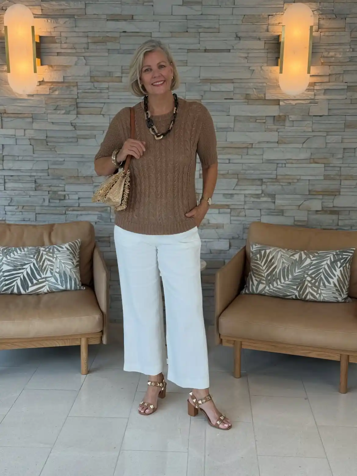 Modern Style: 20 Fall Outfits for Women Over 50 2 1. Cable Knit Top with White Wide Leg Pants