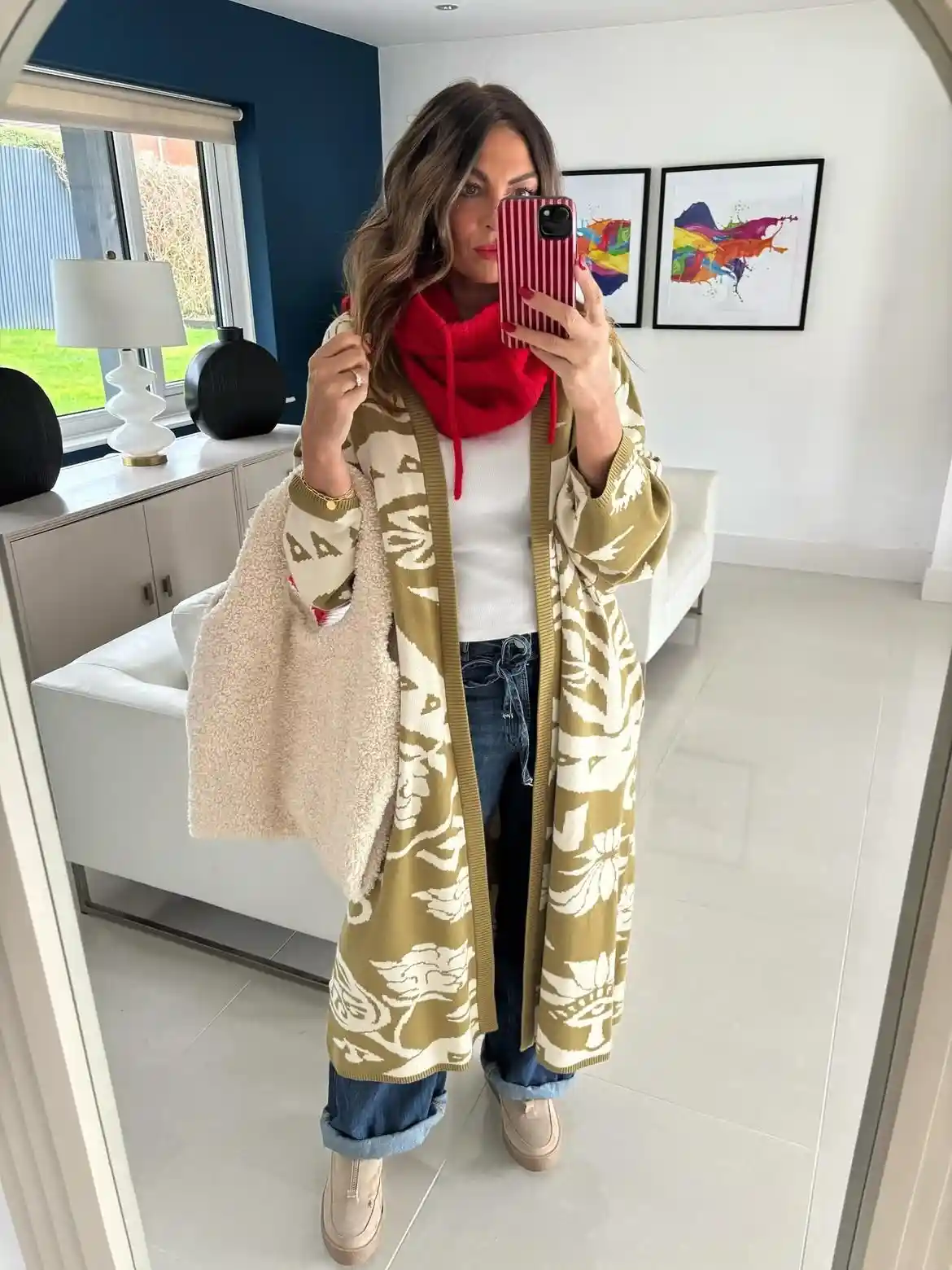 19 Holiday Outfits for Women Over 40 That Work for Parties, Dinners, and Sunny Trips 5 4. Long Patterned Cardigan With a Red Snood