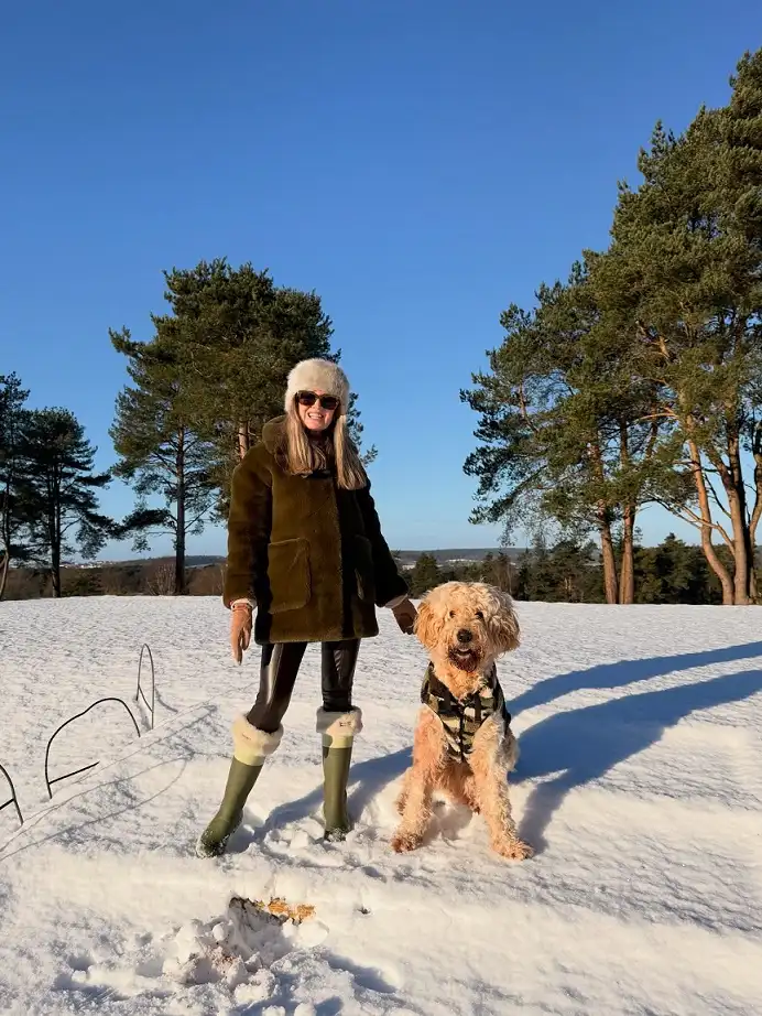 20 Chic Winter Outfits for Women Over 40 That Aren't Frumpy 8 Olive Teddy Coat for Snowy Dog Walks