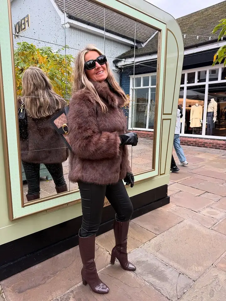 20 Chic Winter Outfits for Women Over 40 That Aren't Frumpy 15 Chocolate Faux Fur Jacket With Croc Boots