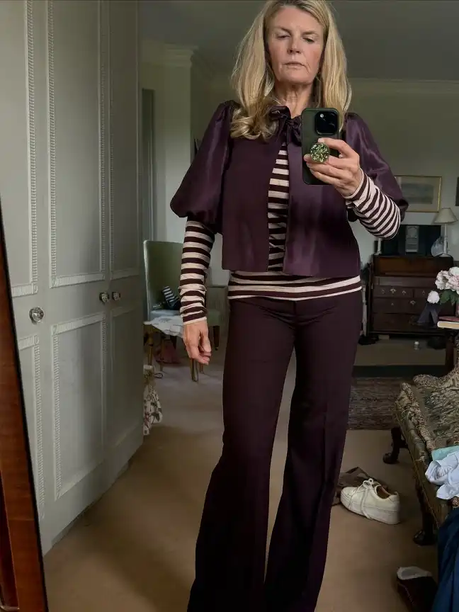 20 Classy Outfits for Women Over 40 5 Plum Satin Jacket over a Striped Tee