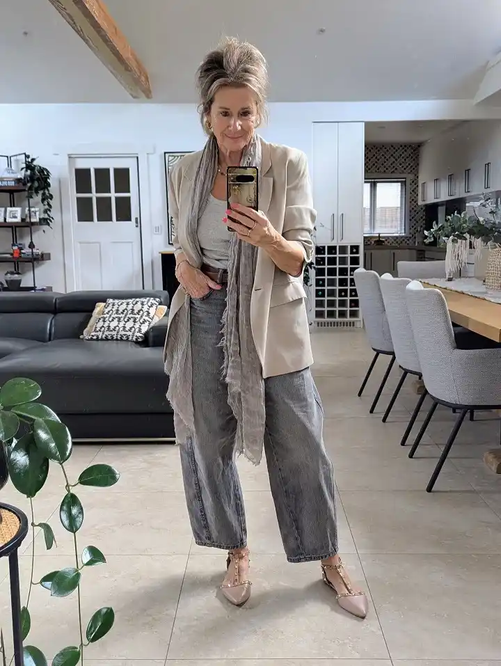 18 Winter Work Outfits for Women Over 40 14 A Beige Blazer And Grey Jeans For A Relaxed Office Friday
