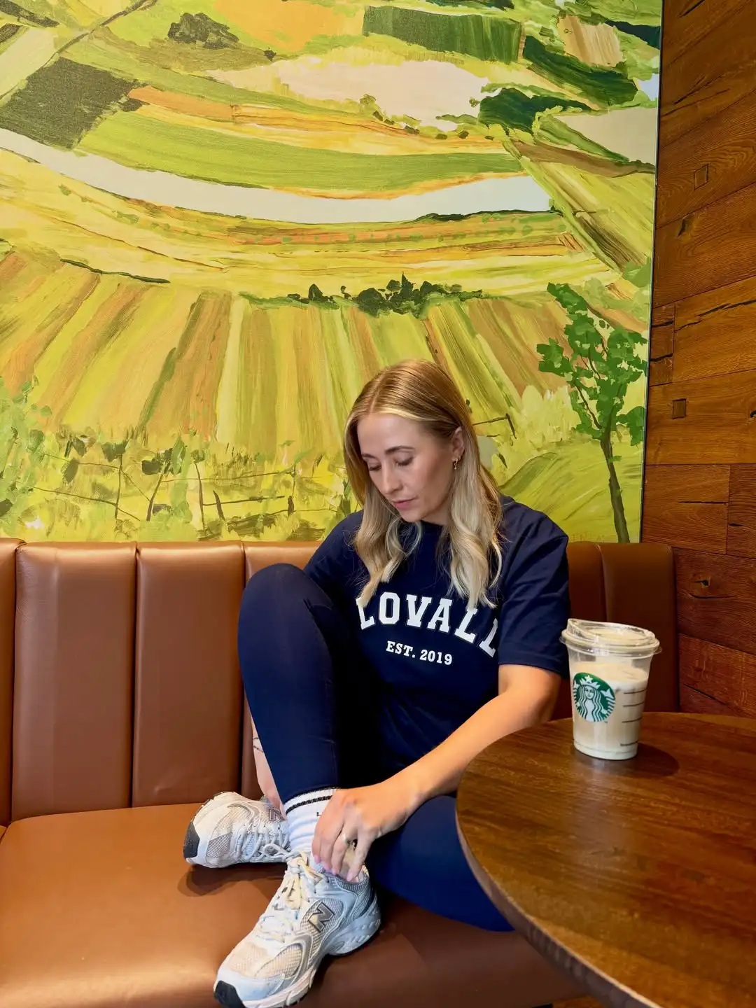 15 Leggings Outfits for Women Over 40 That Don't Look Sloppy 11 10. Graphic Tee with Navy Leggings