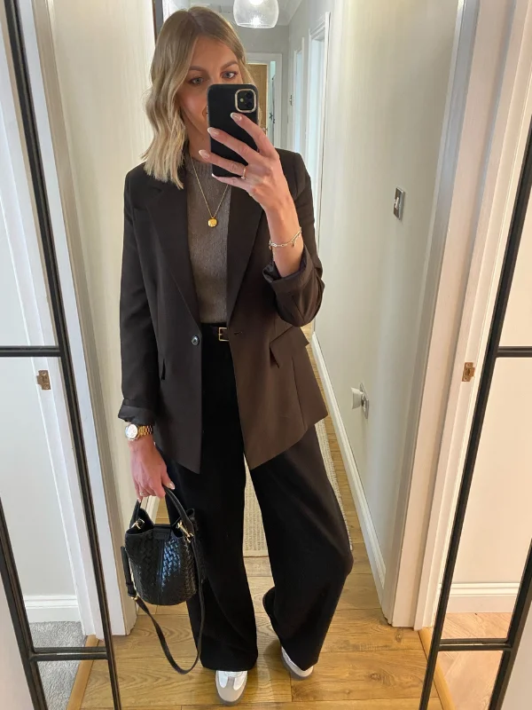 15 Business Casual Outfits for Women Over 40 14 13. Black Blazer with Wide Leg Trousers and Sneakers