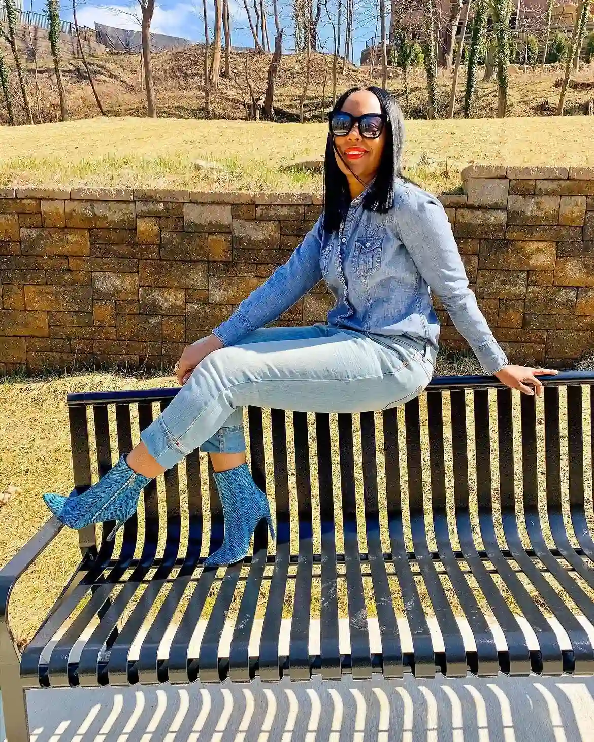 20 Ankle Boot Outfits for Women Over 40 15 14. Denim on Denim with Teal Snake Print Boots