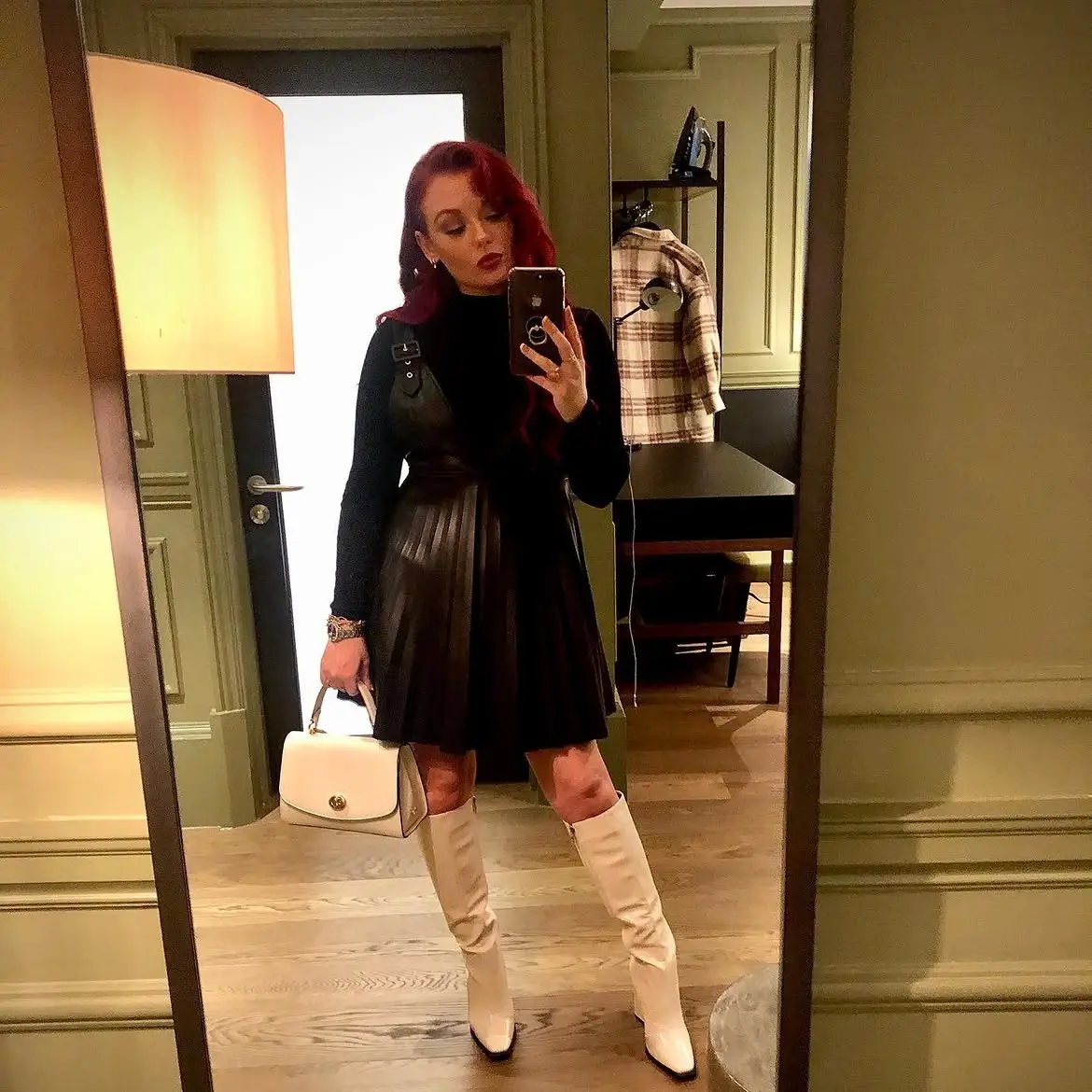 14 Knee-High Boot Outfits Over 40 7 6. Knee-High Boots with a Black Leather Pinafore Dress