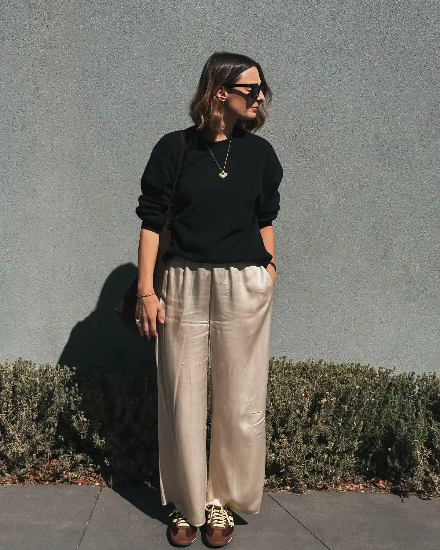 5. Cream Satin Pants With a Black Sweatshirt