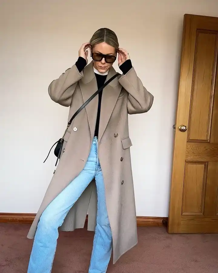 18 Winter Work Outfits for Women Over 40 15 A Wool Coat Thrown Over Jeans For A Fast Morning