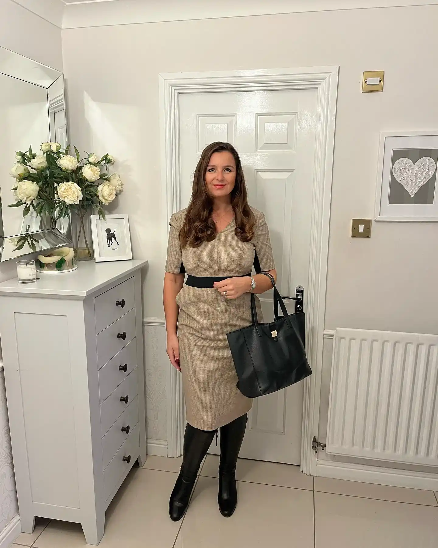 20 Ankle Boot Outfits for Women Over 40 7 6. Tan Sheath Dress with Black Tall Boots