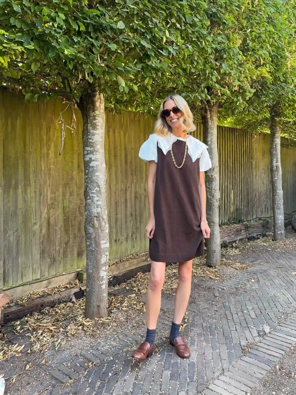 15 Cashmere Outfits for Women Over 40 That Feel Cozy and Polished 16 15. Brown Knit Dress Over a Lace Collar Blouse