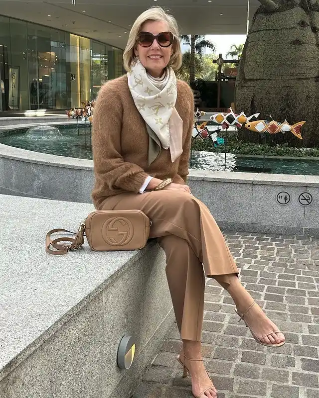 18 Winter Work Outfits for Women Over 40 18 A Fuzzy Camel Sweater Dressed Up With Silk And Gold