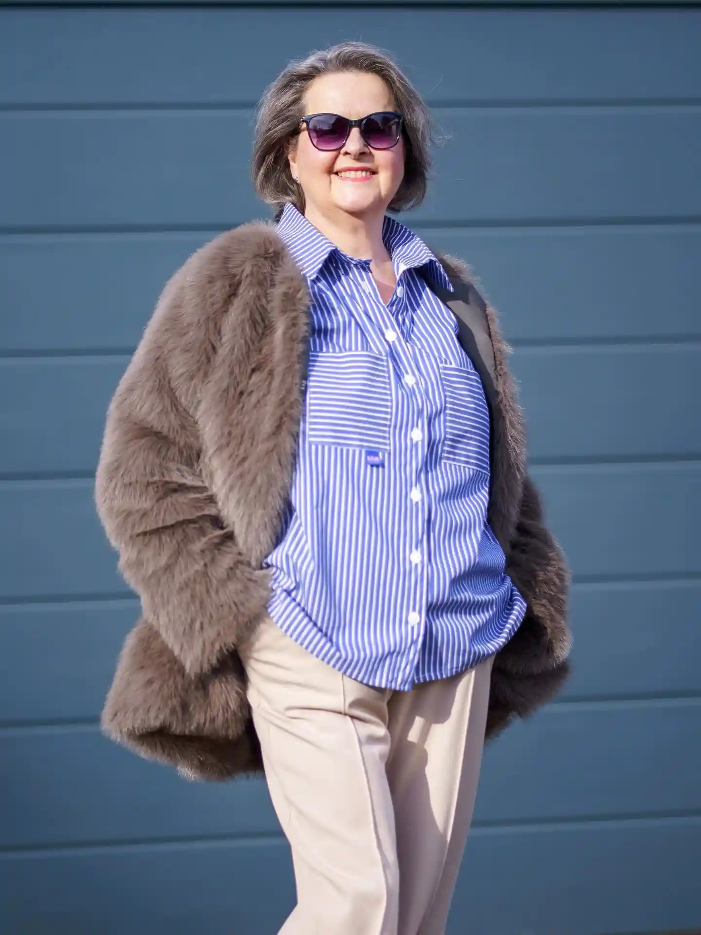 1. Taupe Faux Fur Jacket Over a Striped Shirt