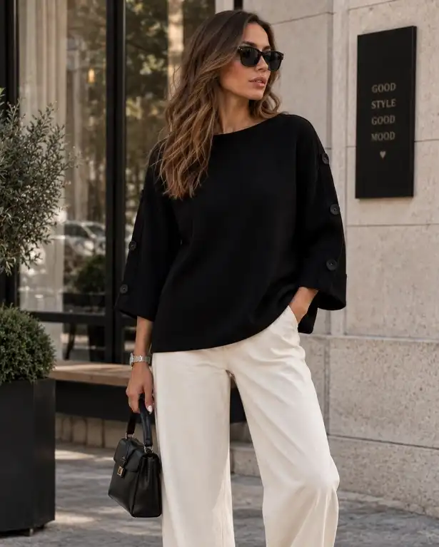 17 Old Money Outfits for Women Over 40 That Look Rich Without Trying 5 A Black Boat Neck Sweater With Cream Wide Leg Trousers