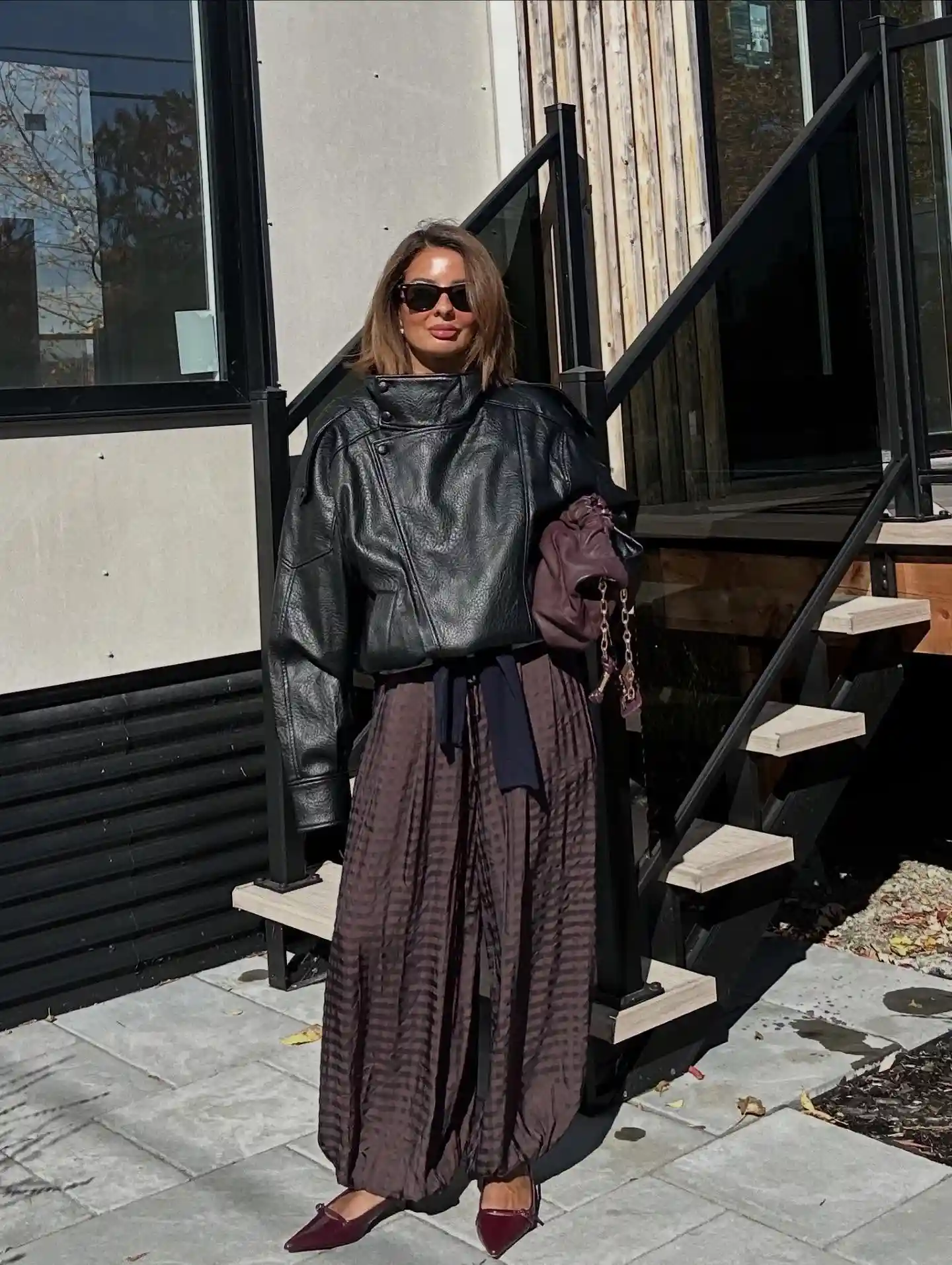 5. Oversized Leather Jacket and Striped Wide Pants