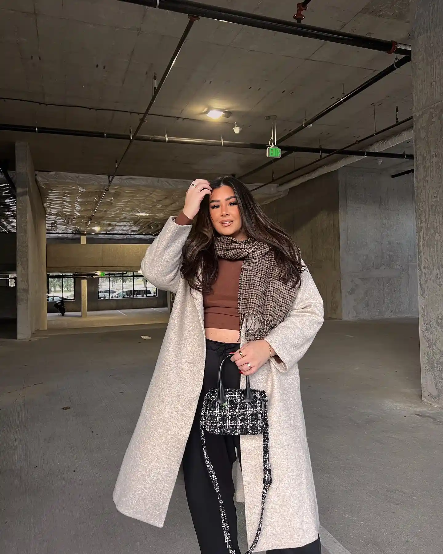 18 Wool Coat Outfits for Women Over 40 You Can Copy This Winter 2 1. Oatmeal Wool Coat With Chocolate Brown and Black Pants
