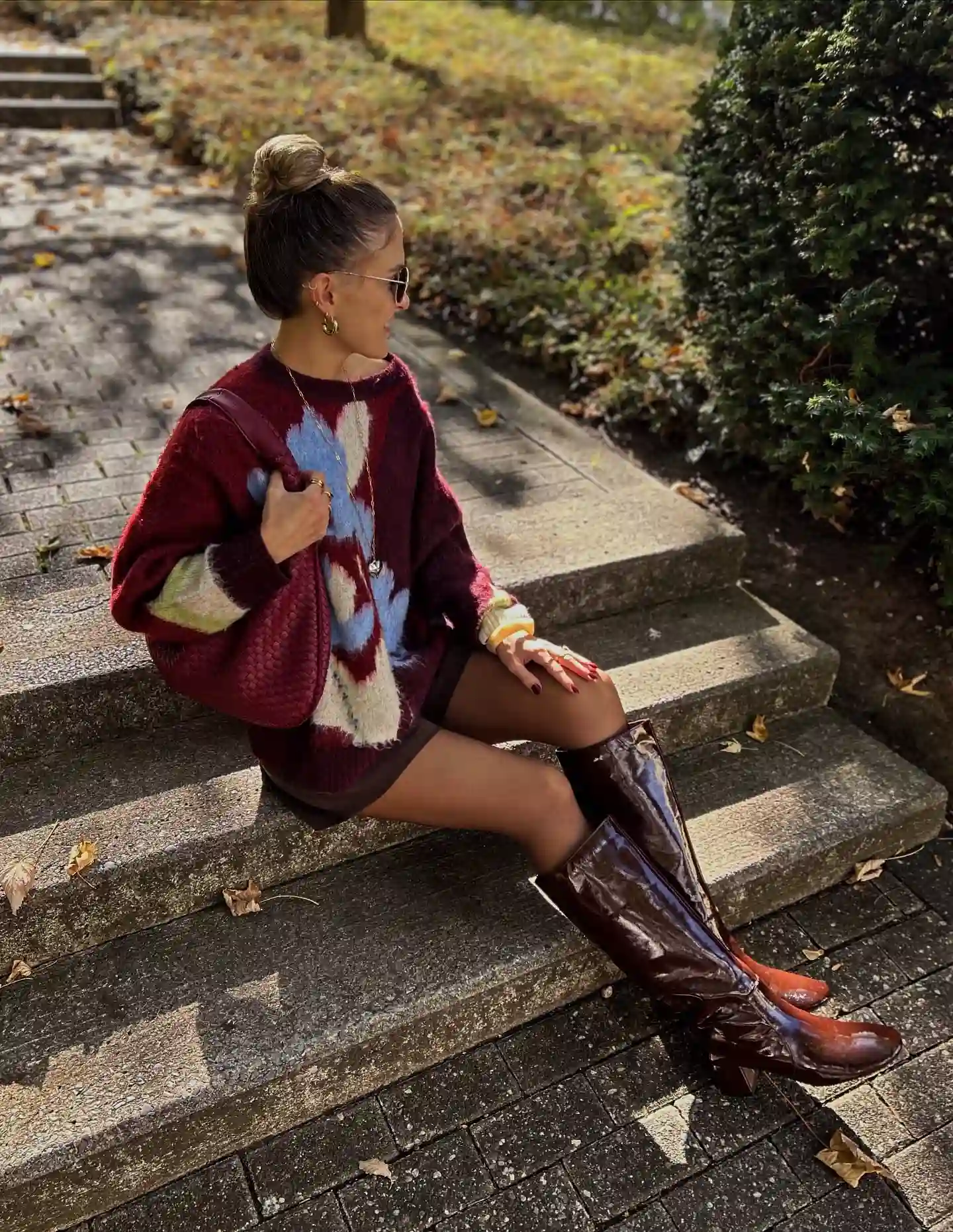 17 Fall Outfits Every Woman Over 40 Will Want to Copy 9 8. Patterned Sweater and Patent Boots