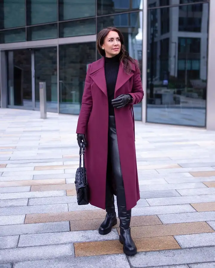 20 Chic Winter Outfits for Women Over 40 That Aren't Frumpy 5 Plum Wrap Coat Over All Black