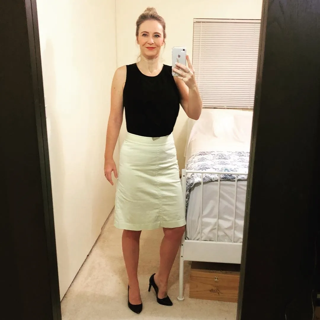 19. Black Sleeveless Top with Pale Pencil Skirt